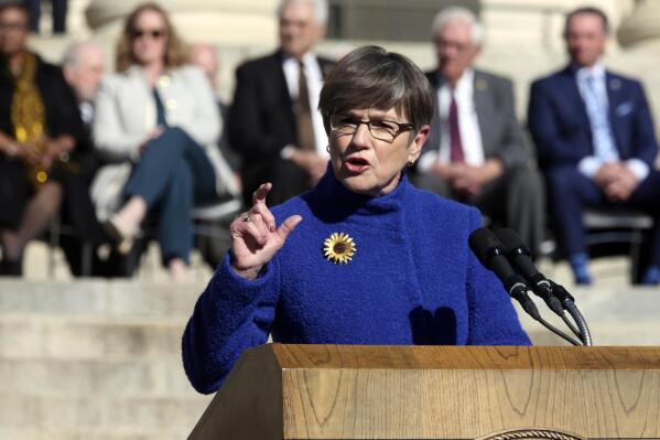 Kansas Gov. Laura Kelly gives her inaugural address at the start of her second term, Monday, Jan. 9, 2023, outside the Statehouse in Topeka, Kan. The Democratic governor has vetoed anti-abortion and anti-diversity provisions included in the next state budget by Republican lawmakers, intensifying a conflict over culture war issues. (AP Photo/John Hanna)