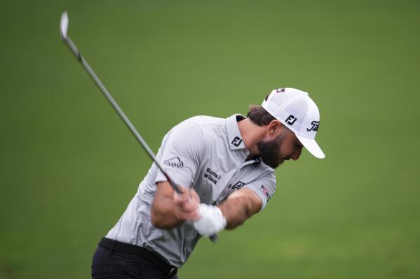 Max Homa works out on the range during a practice for the Masters golf tournament at Augusta National Golf Club, Tuesday, April 4, 2023, in Augusta, Ga. (AP Photo/Matt Slocum)