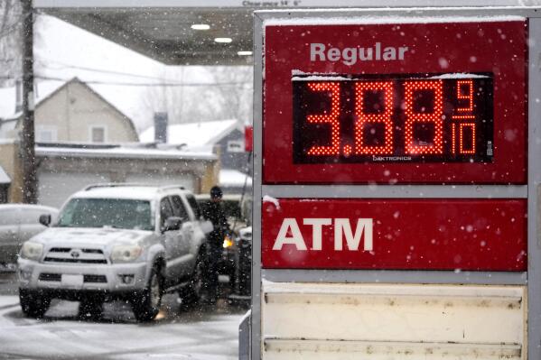 Motorists fill up vehicles at a gas station Wednesday, Feb. 16, 2022, in Denver. U.S. consumer confidence declined modestly this month but remains high, even as prices for just about everything continue to rise. (AP Photo/David Zalubowski)