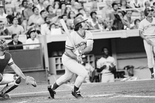 FILE - Cincinnati Reds' Pete Rose flies out in the first inning of a baseball game against the New York Mets, July 24, 1978, at New York's Shea Stadium. Rose agreed to a lifetime ban in 1989 after an investigation for Major League Baseball by lawyer John Dowd found the all-time hit leader placed bets on the Reds to win from 1985-87 while playing for and managing the team. (AP Photo/G. Paul Burnett, File)