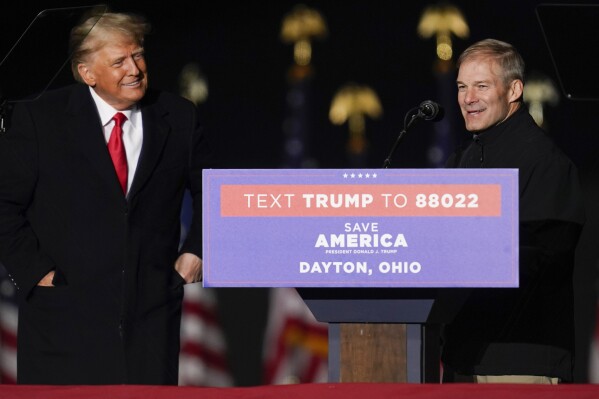 FILE - Former President Donald Trump welcomes Rep. Jim Jordan, R-Ohio, to the stage at a campaign rally in support of the campaign of Ohio Senate candidate JD Vance at Wright Bros. Aero Inc. at Dayton International Airport on Monday, Nov. 7, 2022, in Vandalia, Ohio. (AP Photo/Michael Conroy, File)