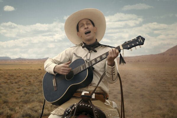 
              This image released by Netflix shows Tim Blake Nelson as Buster Scruggs in a scene from "The Ballad of Buster Scruggs," a film by Joel and Ethan Coen. (Netflix via AP)
            