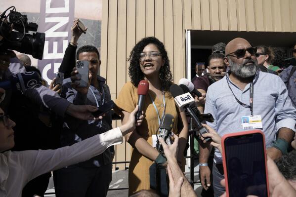 Sanaa Seif, sister of Egypt's jailed leading pro-democracy activist Alaa Abdel-Fattah, who is on a hunger and water strike, speaks to members of the media at the COP27 U.N. Climate Summit, Tuesday, Nov. 8, 2022, in Sharm el-Sheikh, Egypt. (AP Photo/Nariman El-Mofty)