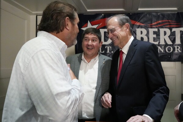 Mississippi Republican Lt. Gov. Delbert Hosemann, right, smiles as he talks with Republican state Sens. Jeremy England, of Vancleave, center, and Scott DeLano, of Biloxi, in Jackson, Miss., Tuesday, Aug. 8, 2023. Hosemann defeated two challengers in the Republican primary for lieutenant governor. (AP Photo/Rogelio V. Solis)