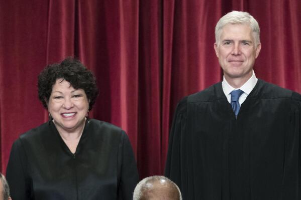 FILE - Associate Justice Sonia Sotomayor, left, and Associate Justice Neil Gorsuch, gather with other justices of the U.S. Supreme Court for an official group portrait, June 1, 2017, at the Supreme Court Building in Washington. (AP Photo/J. Scott Applewhite, File)