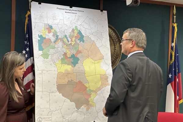 House Reapportionment and Redistricting Committee Chairman Rob Leverett, R-Elberton looks at a state House district map proposed by Republicans, Wednesday, Nov. 29, 2023, at the Georgia Capitol in Atlanta. State lawmakers were ordered to redraw Georgia's legislative and congressional districts after a federal judge ruled some illegally diluted Black voting strength. (AP Photo/Jeff Amy)