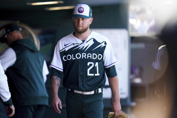Colorado Rockies starting pitcher Kyle Freeland walks into the dugout after being removed from a baseball game in the third inning against the San Diego Padres, Sunday, Sept. 25, 2022, in Denver. (AP Photo/Geneva Heffernan)