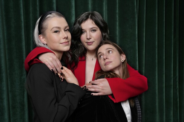 Phoebe Bridgers, from left, Lucy Dacus and Julien Baker of the band boygenius pose for a portrait, Tuesday, Jan. 30, 2024 in Los Angeles. (AP Photo/Chris Pizzello)