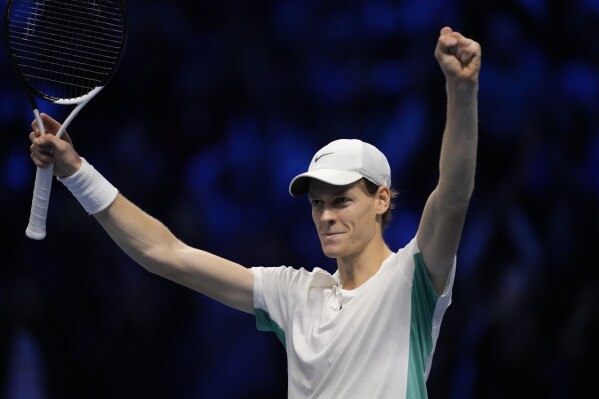 Italy's Jannik Sinner celebrates after winning the singles tennis match against Serbia's Novak Djokovic, of the ATP World Tour Finals at the Pala Alpitour, in Turin, Italy, Tuesday, Nov. 14, 2023. (AP Photo/Antonio Calanni)