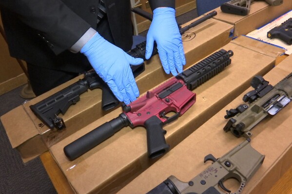 FILE - "Ghost guns" are displayed at the headquarters of the San Francisco Police Department in San Francisco, Nov. 27, 2019. A leading manufacturer of ghost guns has agreed Wednesday, Feb. 21, 2024, to stop selling its untraceable, unassembled firearms to Maryland residents. (APPhoto/Haven Daley, File)