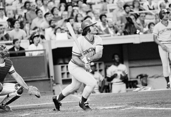 Cincinnati Reds' Pete Rose of the follows through after a long fly-out to the outfield during the first inning of a baseball game agains the New York Mets at New York's Shea Stadium, July 24, 1978. (AP Photo/G. Paul Burnett, File)