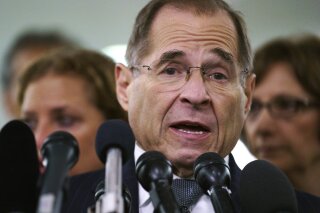 
              FILE - In this Sept. 28, 2018, file photo, House Judiciary Committee ranking member Jerry Nadler, D-N.Y., talks to media during a Senate Judiciary Committee hearing on Capitol Hill in Washington. Nadler, the top Democrat on the House Judiciary Committee says he believes it would be an "impeachable offense" if it's proven that President Donald Trump directed illegal hush-money payments to women during the 2016 campaign. But Nadler, who’s expected to chair the panel in January, says it remains to be seen whether that crime alone would justify Congress launching impeachment proceedings. (AP Photo/Carolyn Kaster, File)
            