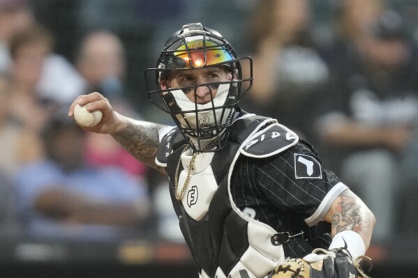 FILE - Chicago White Sox catcher Yasmani Grandal throws down to first during a baseball game against the Texas Rangers Monday, June 19, 2023, in Chicago. The Pittsburgh Pirates are adding two-time All-Star catcher Yasmani Grandal. The club and the 35-year-old Grandal have agreed to terms on a one-year contract worth $2.5 million, a person with knowledge of the deal told The Associated Press Monday, Feb. 12, 2024. (AP Photo/Charles Rex Arbogast, File)