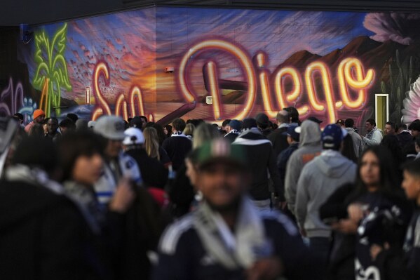 Fans arrive before San Diego FC hosts St. Louis City in an MLS soccer match Saturday, March 1, 2025, in San Diego. (AP Photo/Gregory Bull)