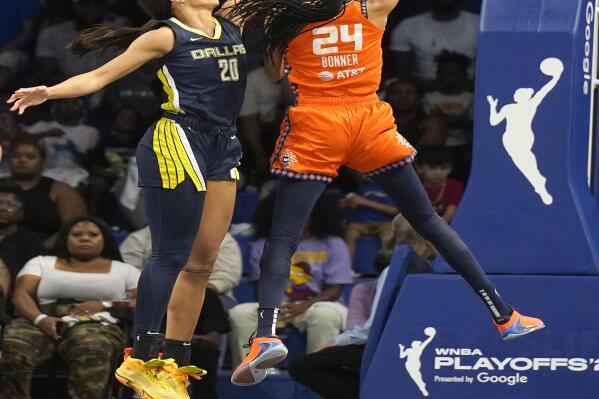 Connecticut Sun forward DeWanna Bonner (24) shoots against Dallas Wings forward Isabelle Harrison (20) during the first quarter of Game 3 of a WNBA first-round playoff series basketball game in Arlington, Texas, Wednesday, Aug. 24, 2022. (AP Photo/LM Otero)