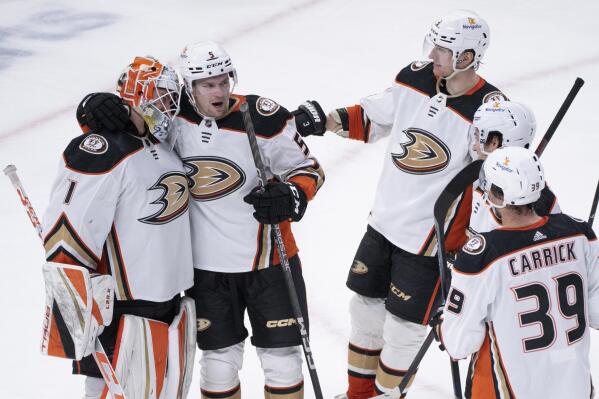 Anaheim Ducks goaltender Lukas Dostal celebrates with teammates after defeating the Montreal Canadiens in an NHL hockey game, Thursday, Dec. 15, 2022 in Montreal. (Paul Chiasson/The Canadian Press via AP)
