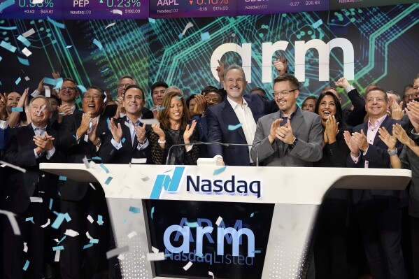 ARM Holdings CEO Rene Haas, center, rings the Nasdaq Opening Bell at the Nasdaq MarketSite, during his company's IPO, in New York's Times Square, Thursday, Sept. 14, 2023. (AP Photo/Richard Drew)