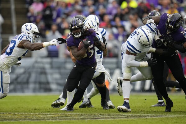 Baltimore Ravens' Gus Edwards (35) rushes during the second half of an NFL football game against the Indianapolis Colts, Sunday, Sept. 24, 2023, in Baltimore. (AP Photo/Julio Cortez)