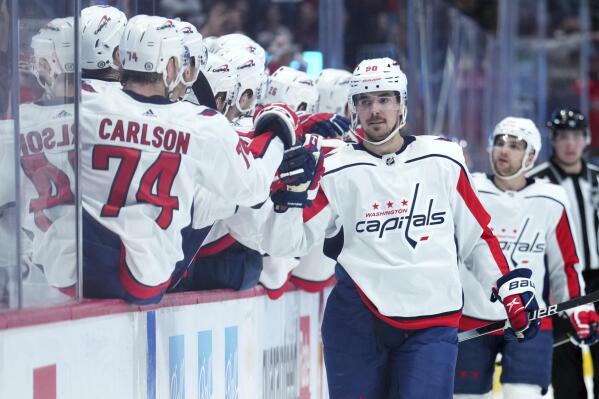 Washington Capitals left wing Marcus Johansson (90) celebrates a goal with teammates on the bench during the third period of an NHL hockey game against the Colorado Avalanche, Monday, April 18, 2022, in Denver. (AP Photo/Jack Dempsey)