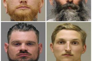 FILE - This combination of photos provided by the Kent County Sheriff and the Delaware Department of Justice shows, top row from left, Brandon Caserta and Barry Croft; and bottom row from left, Adam Dean Fox and Daniel Harris. The four members of anti-government groups are facing trial in March 2022 on federal charges accusing them in a plot to abduct Michigan's Democratic Gov. Gretchen Whitmer in 2020. Jury selection begins Tuesday, March 8, 2022, in a trial the presiding judge at the U.S. District Court courthouse in Grand Rapids, Mich., said could take over a month. (Kent County Sheriff, Delaware Department of Justice via AP File)
