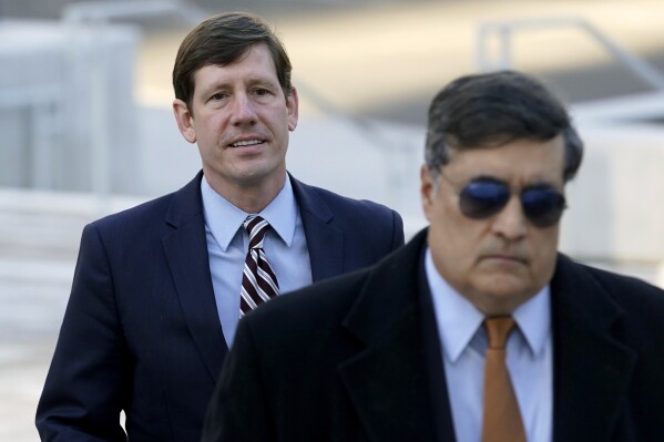 FILE - Former Republican state Sen. Brian Kelsey, left, arrives at federal court, Nov. 22, 2022, in Nashville, Tenn. On Friday, Aug. 11, 2023, Kelsey was sentenced to 21 months in prison after he pleaded guilty to federal campaign finance charges, then unsuccessfully tried to take back his guilty plea. (AP Photo/Mark Humphrey, File)