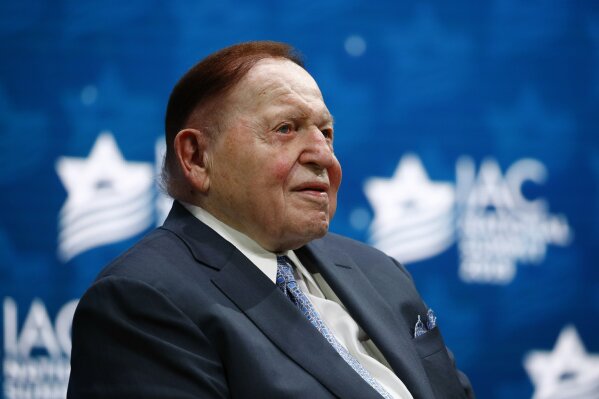 FILE - In this Dec. 7, 2019, file photo, Las Vegas Sands Corporation Chief Executive Sheldon Adelson sits onstage before President Donald Trump speaks at the Israeli American Council National Summit in Hollywood, Fla. The State Department has informally confirmed to Congress that Republican super-donor Adelson is the buyer of the U.S. ambassador’s official residence in Israel, a congressional aide told The Associated Press on Wednesday, Sept. 9, 2020. Lawmakers in the House and Senate are now looking into whether the deal complied with regulations. (AP Photo/Patrick Semansky, File)