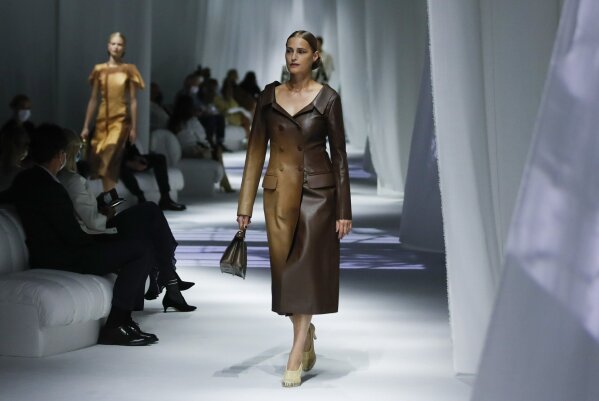 Model Yasmin Le Bon wears a creation as part of the Fendi 2021 women's spring-summer ready-to-wear collection during the Milan's fashion week in Milan, Italy, Wednesday, Sept. 23, 2020. (AP Photo/Antonio Calanni)