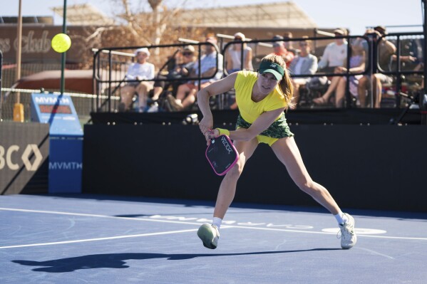 In this image provided by the Carvana PPA Tour, professional tennis player Eugenie Bouchard plays a shot during a pickleball match, Feb.. 6, 2025, in Tucson, Ariz. (Carvana PPA Tour via AP)