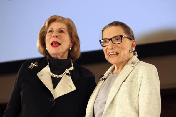 FILE - NPR's Nina Totenberg, left, and U.S. Supreme Court Justice Ruth Bader Ginsburg appear during a question and answer session as part of the Museum of the City of New York's David Berg Distinguished Speakers Series in New York on Dec. 15, 2018. Totenberg is the author of “Dinners with Ruth” a new memoir that celebrates her relationship with Ginsburg.  (AP Photo/Rebecca Gibian, File)