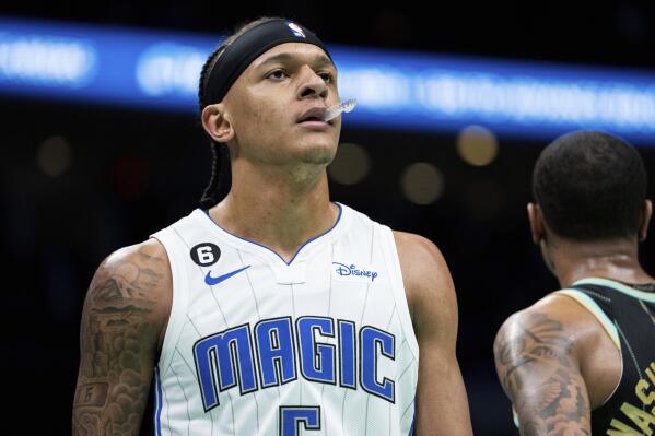 Orlando Magic forward Paolo Banchero looks on during the first half of an NBA basketball game against the Charlotte Hornets in Charlotte, N.C., Sunday, Feb. 5, 2023. (AP Photo/Jacob Kupferman)