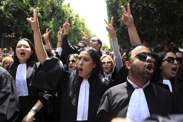 Tunisian lawyers take part in a protest against the recent arrests of their colleagues, in Tunis, Tunisia, Thursday, May 16, 2024. (AP Photo/Anis Mili)