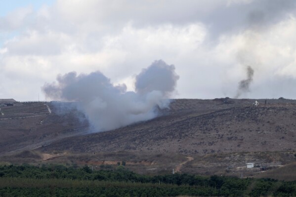An explosion can be seen along Israel's northern border with Lebanon, Wednesday, Nov. 20, 2024. (AP Photo/Ohad Zwigenberg)