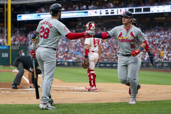St Louis Cardinals' Nolan Gorman, right, celebrates his two-run home run with Nolan Arenado, left, during the first inning of a baseball game against the St Louis Cardinals, Sunday, June 2, 2024, in Philadelphia. (AP Photo/Chris Szagola)