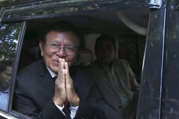 Former President of Cambodia National Rescue Party, Kem Sokha, greets from his car in front of his house in Phnom Penh, Cambodia, Friday, March 3, 2023. Cambodia’s beleaguered pro-democracy forces face another day of reckoning Friday, as the country’s most prominent opposition politician not in exile is scheduled to hear the verdict in his trial for treason.(AP Photo/Heng Sinith)