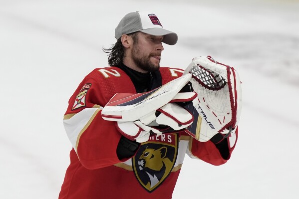 Florida Panthers goaltender Sergei Bobrovsky acknowledges the crowd after his team defeated the New York Rangers in Game 6 to win the Eastern Conference finals of the NHL hockey Stanley Cup playoffs Saturday, June 1, 2024, in Sunrise, Fla. (AP Photo/Lynne Sladky)
