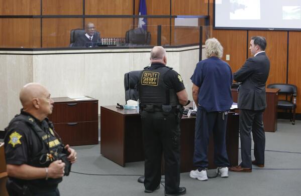 Curtis Edward Smith, accompanied by his attorney Jarrett Bouchette, faces Judge Clifton Newman during a hearing at Richland County Bond court, Tuesday June, 28, 2022, in Columbia, S.C. Smith is charged with two counts of conspiracy, four counts of money laundering, three counts of forgery and multiple drug related charges. (Tracy Glantz/The State via AP)