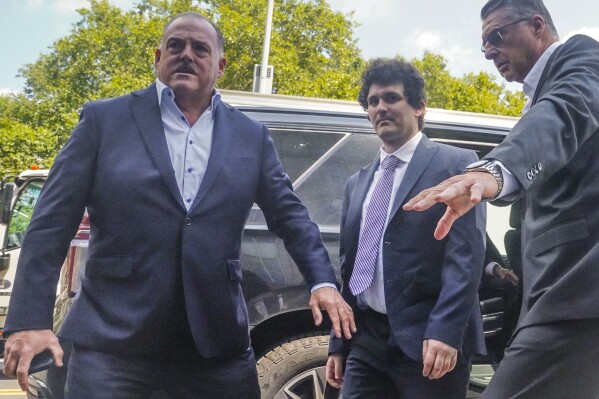 FTX founder Sam Bankman-Fried arrives at Manhattan federal court, Friday, Aug. 11, 2023, in New York. Bankman-Fried returned to New York City for a bail hearing Friday that could decide whether the fallen cryptocurrency wiz must go to jail while he awaits trial. (AP Photo/Bebeto Matthews)