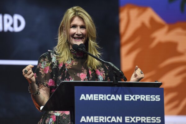 Laura Dern accepts the career achievement award for her roles in "Marriage Story" and "Little Women" at the 31st annual Palm Springs International Film Festival Awards Gala on Thursday, Jan. 2, 2020, in Palm Springs, Calif. (AP Photo/Chris Pizzello)