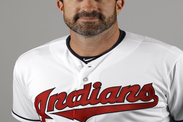 FILE - This is a 2016 file photo showing Mickey Callaway of the Cleveland Indians baseball team. Indians president of baseball operations Chris Antonetti said he couldn't comment on previous remarks made about Mickey Callaway's behavior due to Major League Baseball's ongoing investigation into allegations the team's former pitching coach sexually harassed women. Antonetti joined manager Terry Francona for his Zoom availability on Wednesday, March 3, 2021, a day after a story by The Athletic said several former Indians employees had come forward in the last month to say the team's front office was aware of Callaway's actions. (AP Photo/Morry Gash, File)