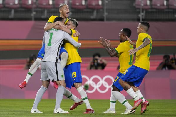Brazil's players celebrate after defeating Mexico in a penalty shootout in a men's soccer semifinal match at the 2020 Summer Olympics, Tuesday, Aug. 3, 2021, in Kashima, Japan. (AP Photo/Fernando Vergara)