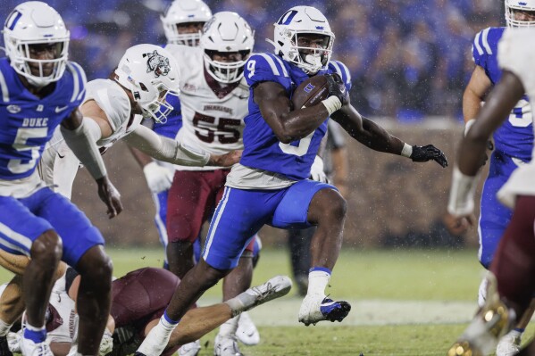 Duke's Jaquez Moore (9) carries the ball past the Lafayette defense for a touchdown during the second half of an NCAA college football game in Durham, N.C., Saturday, Sept. 9, 2023. (AP Photo/Ben McKeown)