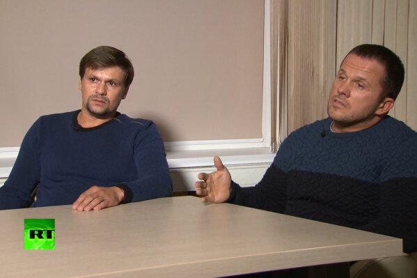 
              FILE - In this video grab provided by the RT channel on Thursday, Sept. 13, 2018, Ruslan Boshirov, left, and Alexander Petrov attend their first public appearance in an interview with the RT channel in Moscow, Russia. The investigative group Bellingcat says it has identified one of the two suspects in the poisoning of an ex-Russian spy as a highly-decorated colonel of the Russian military intelligence agency GRU. Bellingcat said Wednesday, Sept. 26 that the suspect whose passport name was Ruslan Boshirov is in fact Col. Anatoliy Chepiga. (RT channel video via AP)
            