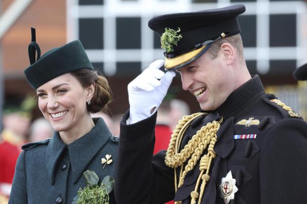 FILE- Britain's Prince William and Kate, Duchess of Cambridge attend the 1st Battalion Irish Guards' St. Patrick's Day Parade at Mons Barracks, March 17, 2022 in Aldershot, England. Prince William and his wife Catherine are embarking on a tour to Central America and the Caribbean, even as some countries in the region mull cutting ties to the British monarchy. The couple will visit Belize, Jamaica and the Bahamas on the week-long journey that starts Saturday, March 19, 2022. (Chris Jackson/Pool via AP, file)