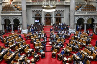 FILE - The New York state Assembly Chamber is seen during a legislative session after Gov. Kathy Hochul presented her 2025 executive state budget at the state Capitol, Jan. 16, 2024, in Albany, N.Y. New York lawmakers passed a $237 billion state budget Saturday, April 20, that includes plans to spur housing construction and combat unlicensed marijuana stores. (AP Photo/Hans Pennink, File)