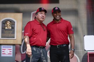 Former Cincinnati Reds player Johnny Bench, left, and Barry Larkin participate in Joe Morgan Day at a baseball game between the Pittsburgh Pirates and the Reds at Great American Ballpark in Cincinnati on Sunday, Aug. 8, 2021. (AP Photo/Jeff Dean)