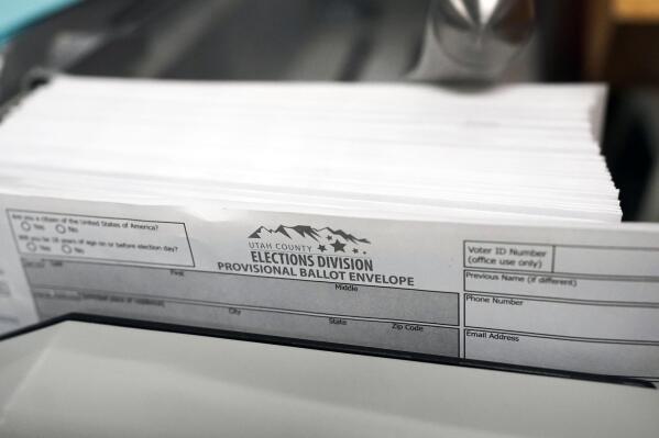 FILE - Utah County election division provisional ballot envelopes are viewed during a tour of Utah County's elections equipment and review processes for administering secure elections April 19, 2022, in Provo, Utah. Provisional ballots are issued to voters at a polling location when there are eligibility questions that prevent them from casting a regular ballot on Election Day. (AP Photo/Rick Bowmer, File)