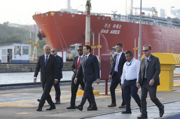 U.S. Secretary of State Marco Rubio and Panama Canal Authority Administrator Ricuarte Vásquez, left, tour the Miraflores Locks at the Panama Canal in Panama City, Sunday, Feb. 2, 2025. (AP Photo/Mark Schiefelbein, Pool)