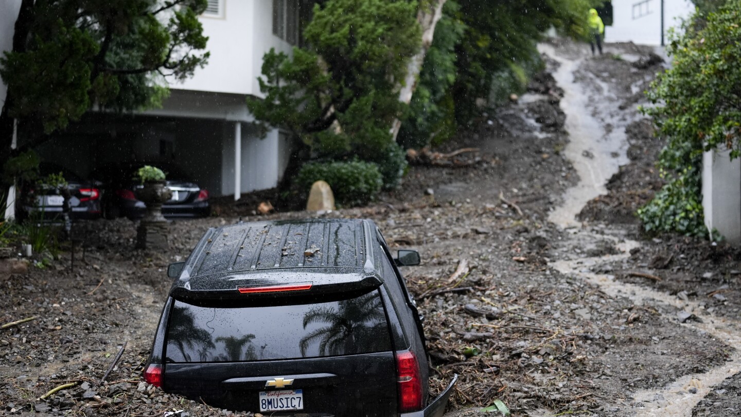 Document-setting typhoon that killed 3 dumps rain on Los Angeles; flash flood indicators nonetheless in impact