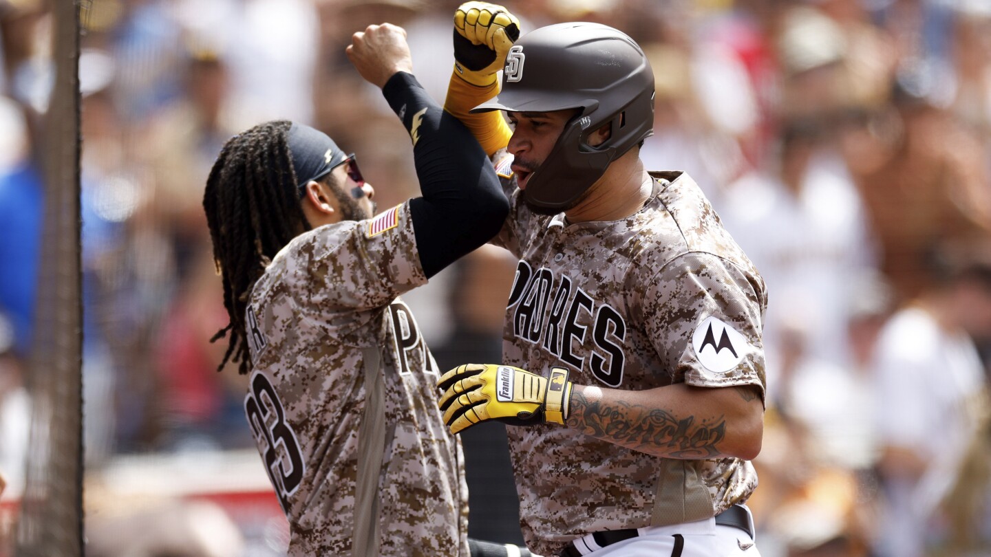 Gary Sanchez of the San Diego Padres, is congratulated by Fernando News  Photo - Getty Images