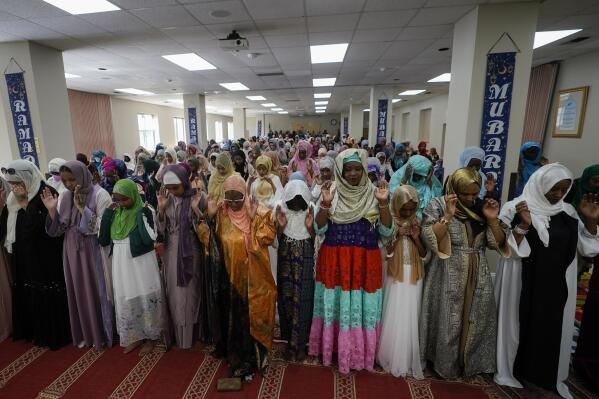 Women gather for prayer during Eid al-Fitr, Friday, April 21, 2023, at the Muslim Community Center in Silver Spring, Md. Eid al-Fitr marks the end of the Muslim holy fasting month of Ramadan. (AP Photo/Carolyn Kaster)